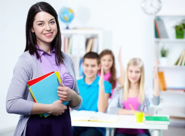 happy-teacher-with-students-background_1098-2917